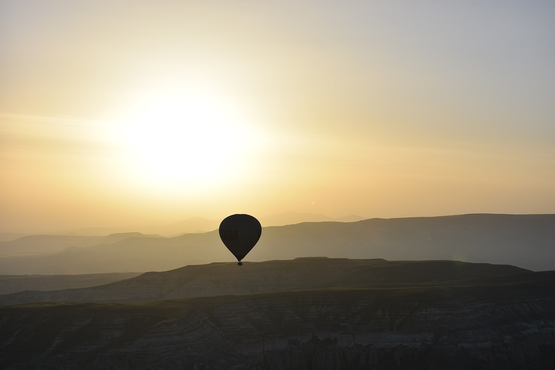 Hot air balloons over Cappadocia at sunrise
